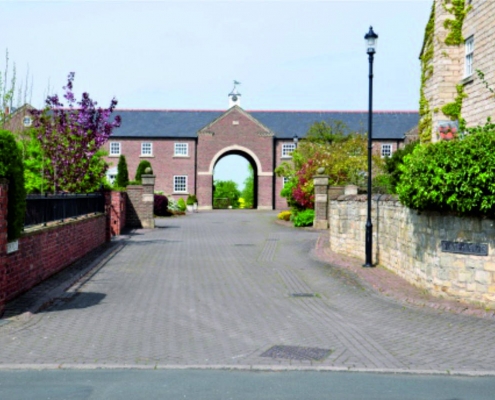 New Hall Court, Northfields, Bickerton Courtyard with large Arch leading to fields
