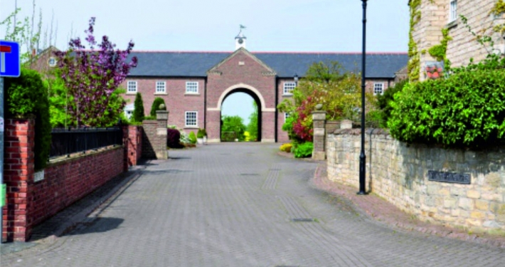New Hall Court, Northfields, Bickerton Courtyard with large Arch leading to fields