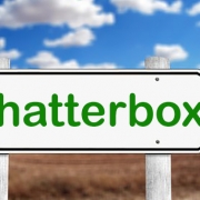 Chatterbox signpost. Green letters on a white signboard pointing right